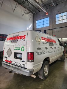 Edmonds Batteries service van with custom commercial lettering and vinyl decals