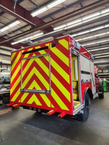 Reflective chevrons applied to the back of a fire truck