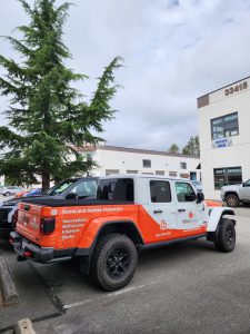 RenoMagic Jeep Gladiator with orange partial commercial wrap and contractor graphics