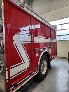 Fire Department fire truck with custom lettering and emergency vehicle graphics