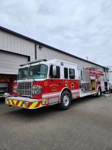 Fire Department fire truck with custom lettering and emergency vehicle graphics