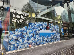 Large-format BMO commercial window graphics installed across a glass storefront