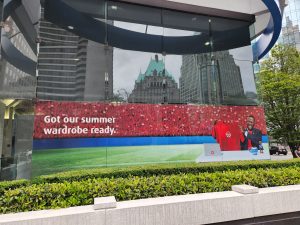 Large-format BMO commercial window graphics installed across a glass storefront