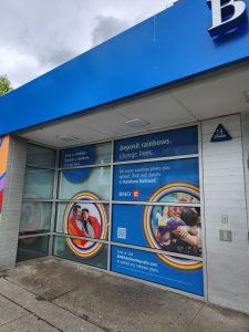 BMO storefront with custom printed rainbow window graphics and promotional decals